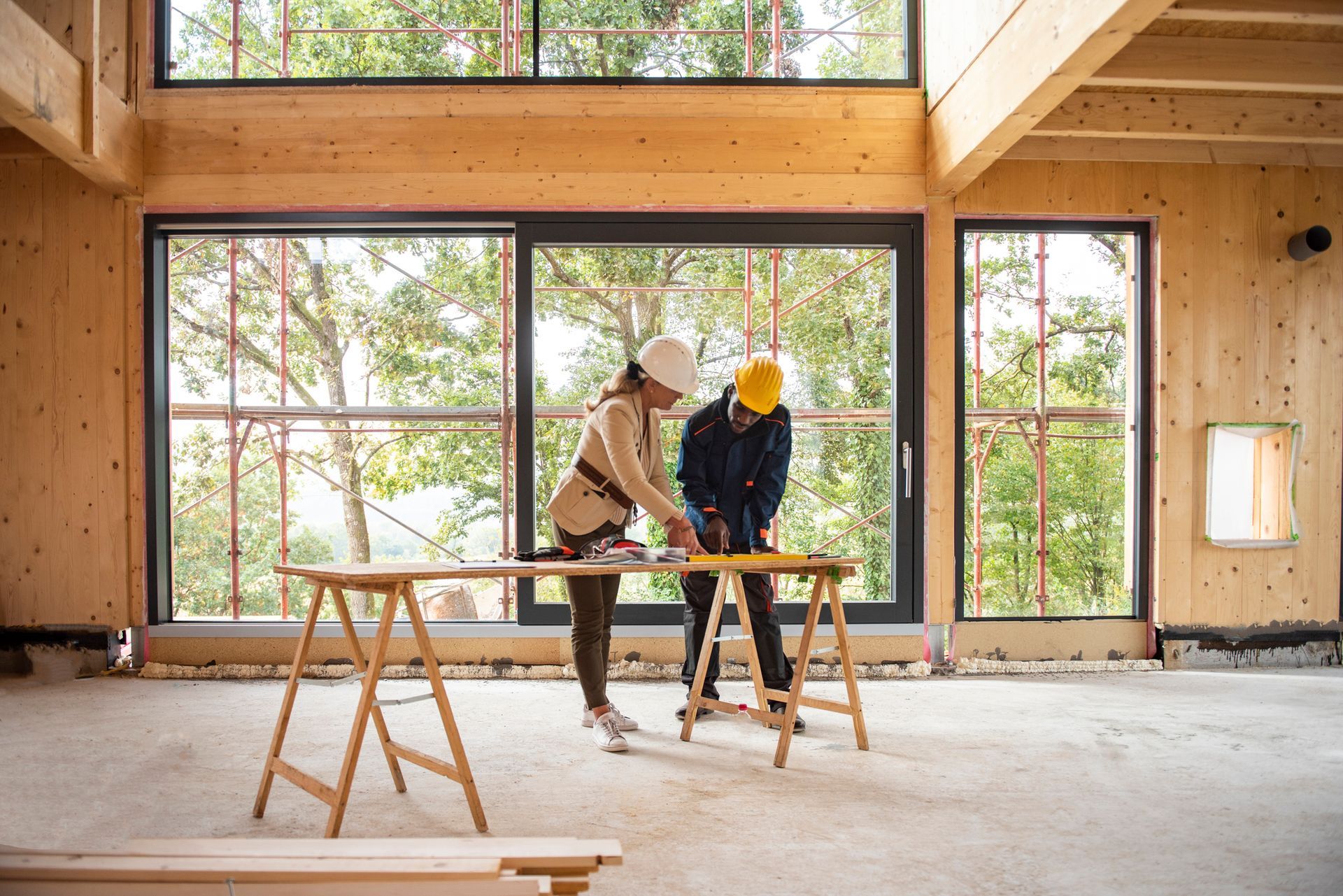 A Man And A Woman Are Working On A Wooden Structure - Owingsville, KY - Withrow Builders