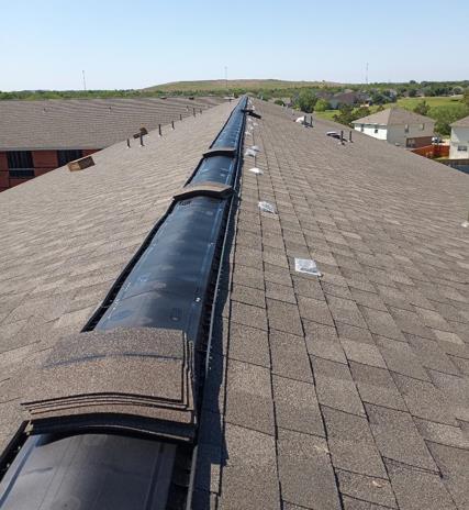 A roof with a drain on the side of it