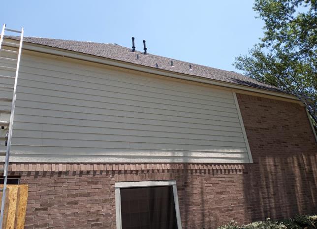 A house with a ladder on the side of it