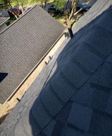A close up of a roof with shingles on it.
