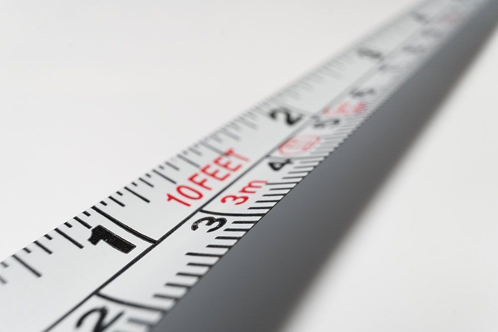 Tape measure showing feet and meter measurements.