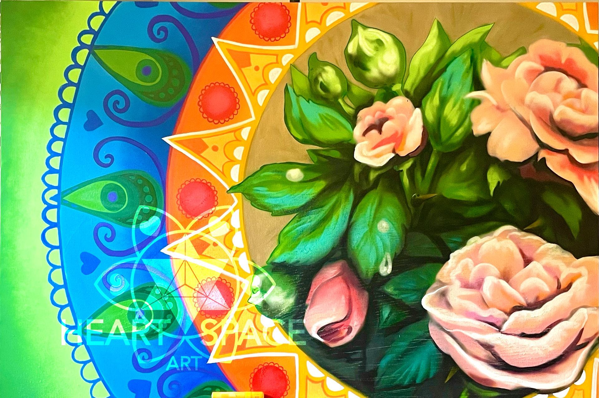 Spray painted canvas of pink roses surrounded by a rainbow mandala. This painting was created live as a painting performance in front of the Museum of Contemporary Art (MOCA) for the Downtown Event.  