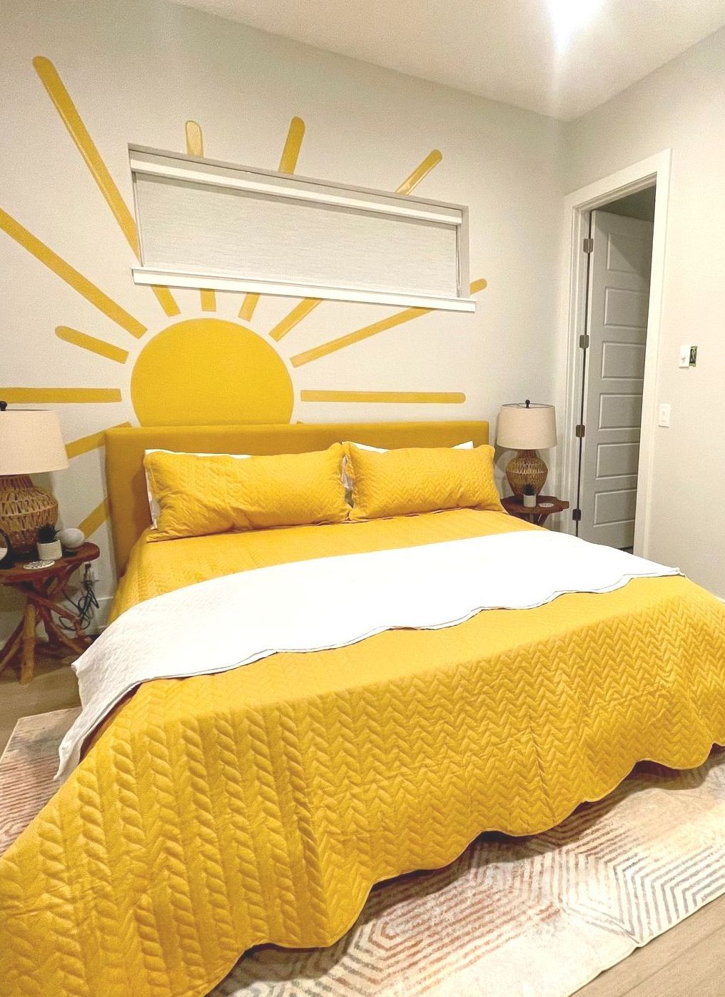 Sunrise and sunset accent wall behind a king size bed at the Waterway Stay Short term rental/Airbnb, Palm Coast, Florida.