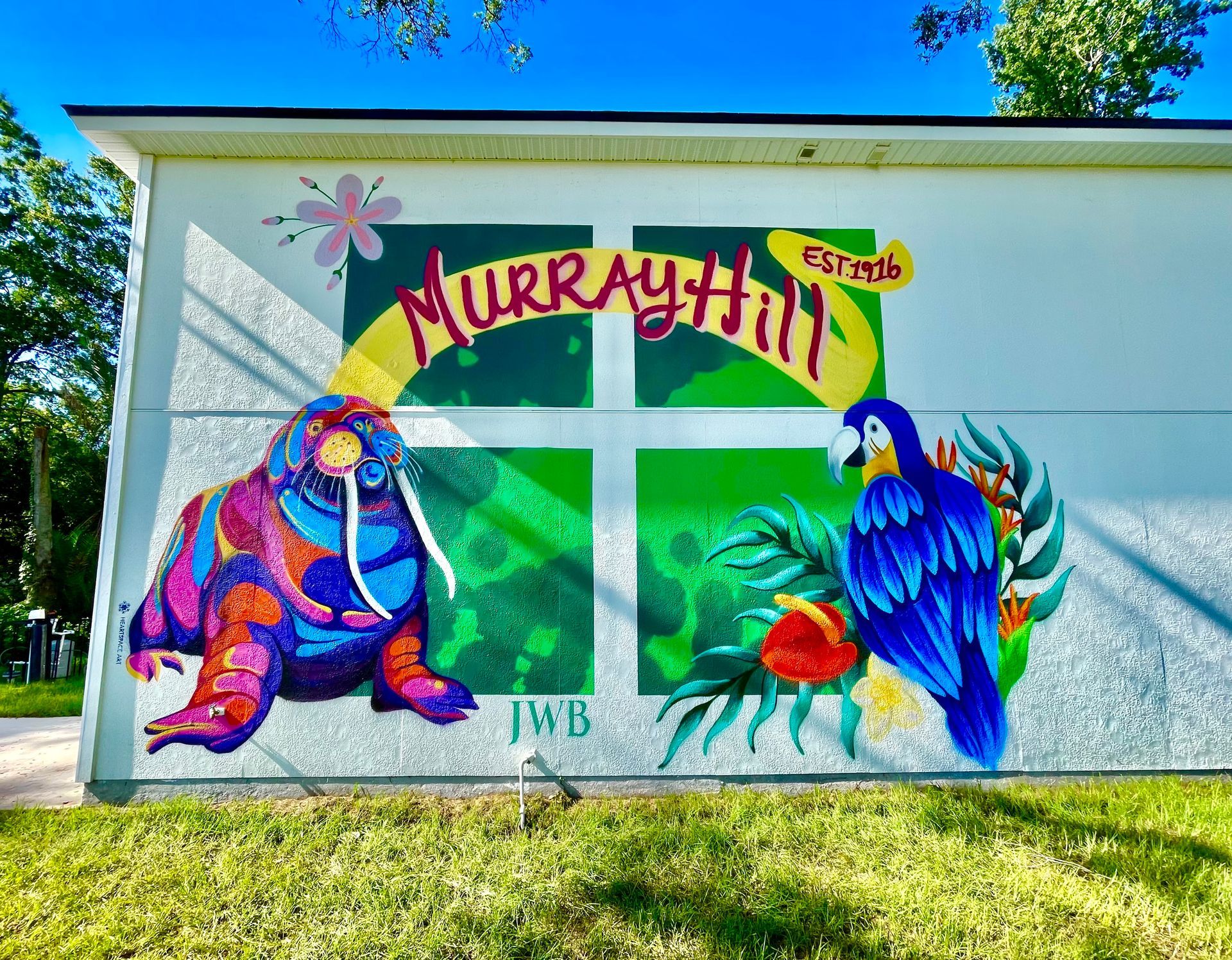 This is an outdoor spraypaint mural done for JWB rental properties in Murray Hill, Jacksonville Florida. This mural, outside a local rental home, features a parrot and walrus, an ode to a local resturant in the area 