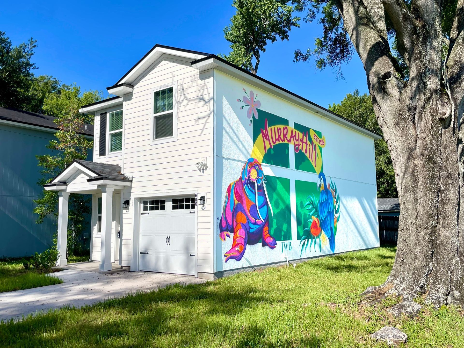 This is an outdoor spraypaint mural done for JWB rental properties in Murray Hill, Jacksonville Florida. This mural, outside a local rental home, features a parrot and walrus, an ode to a local resturant in the area 