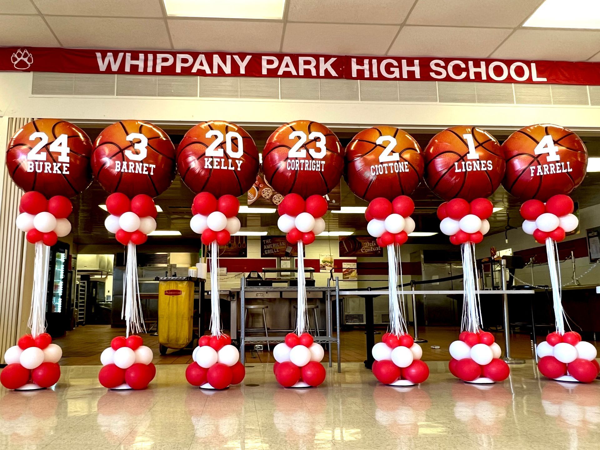 Whippany park high school is decorated with red and white balloons and basketballs