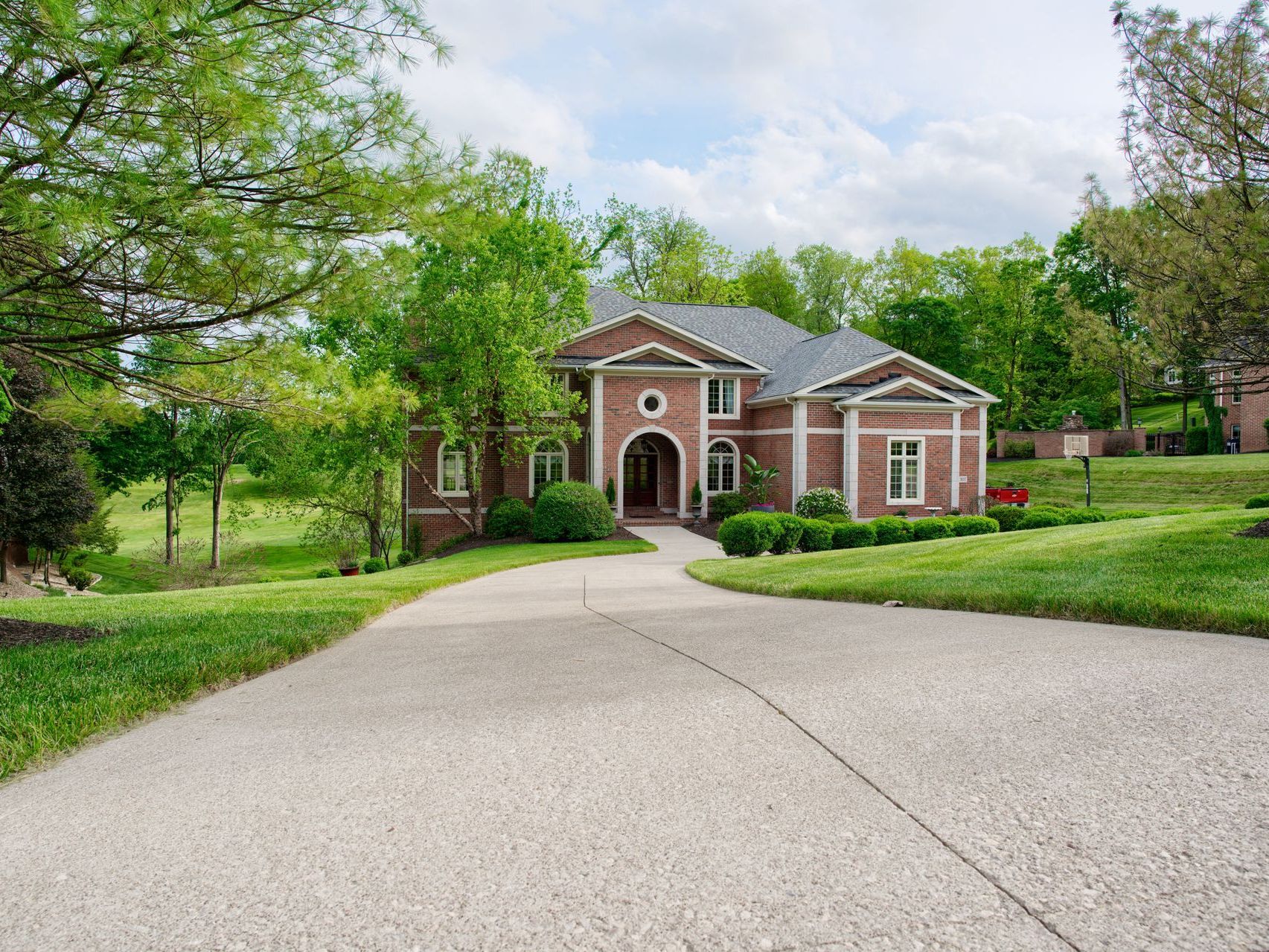 A blue house with a wooden fence in front of it