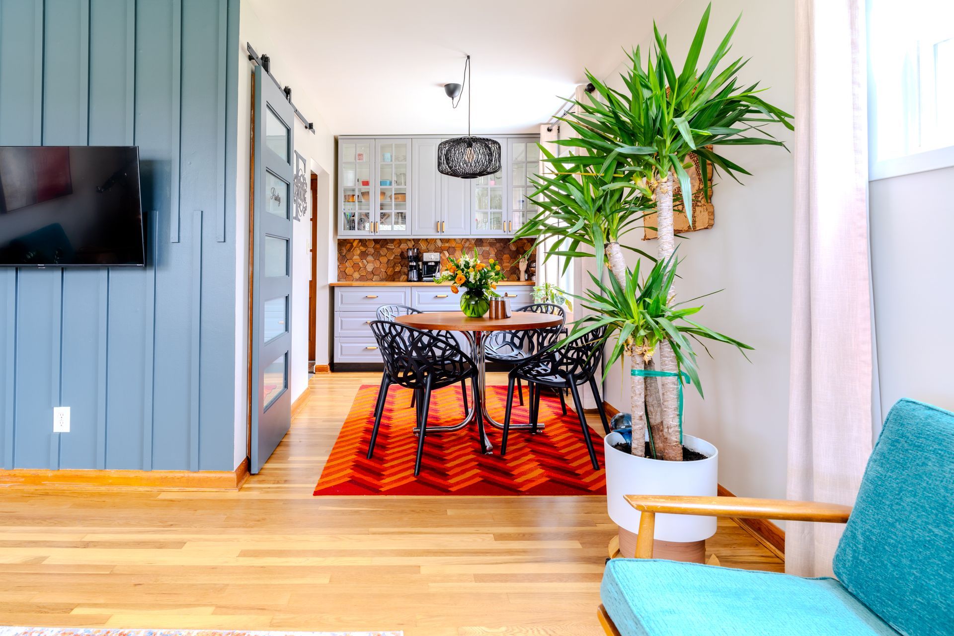 a large indoor swimming pool in a cabin with a wooden ceiling .