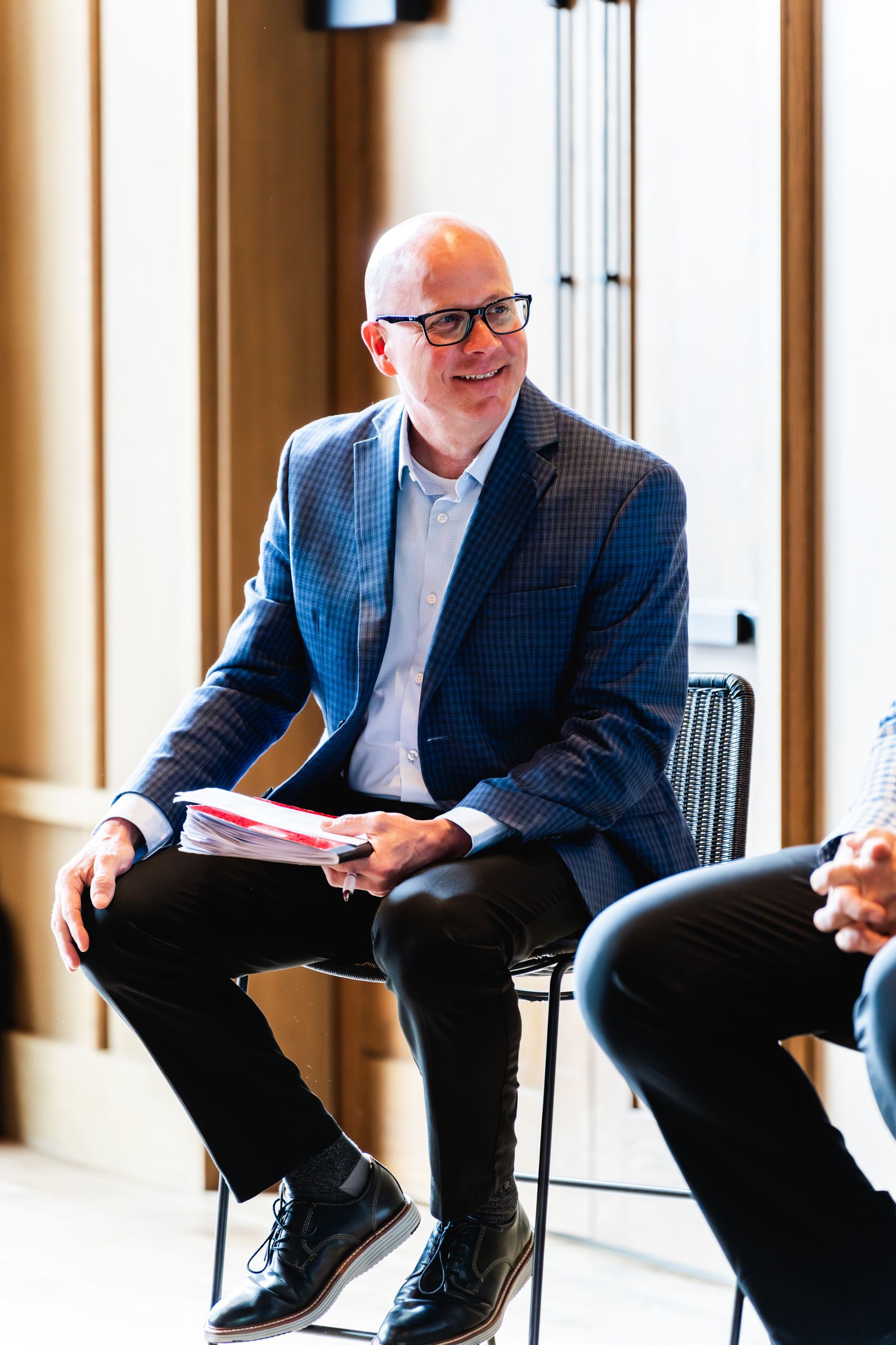 a group of people are posing for a picture on a set of stairs .