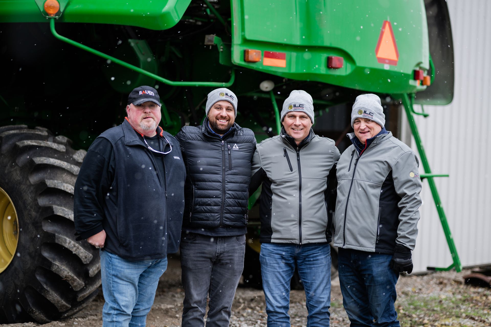A group of people are sitting in chairs watching a presentation.