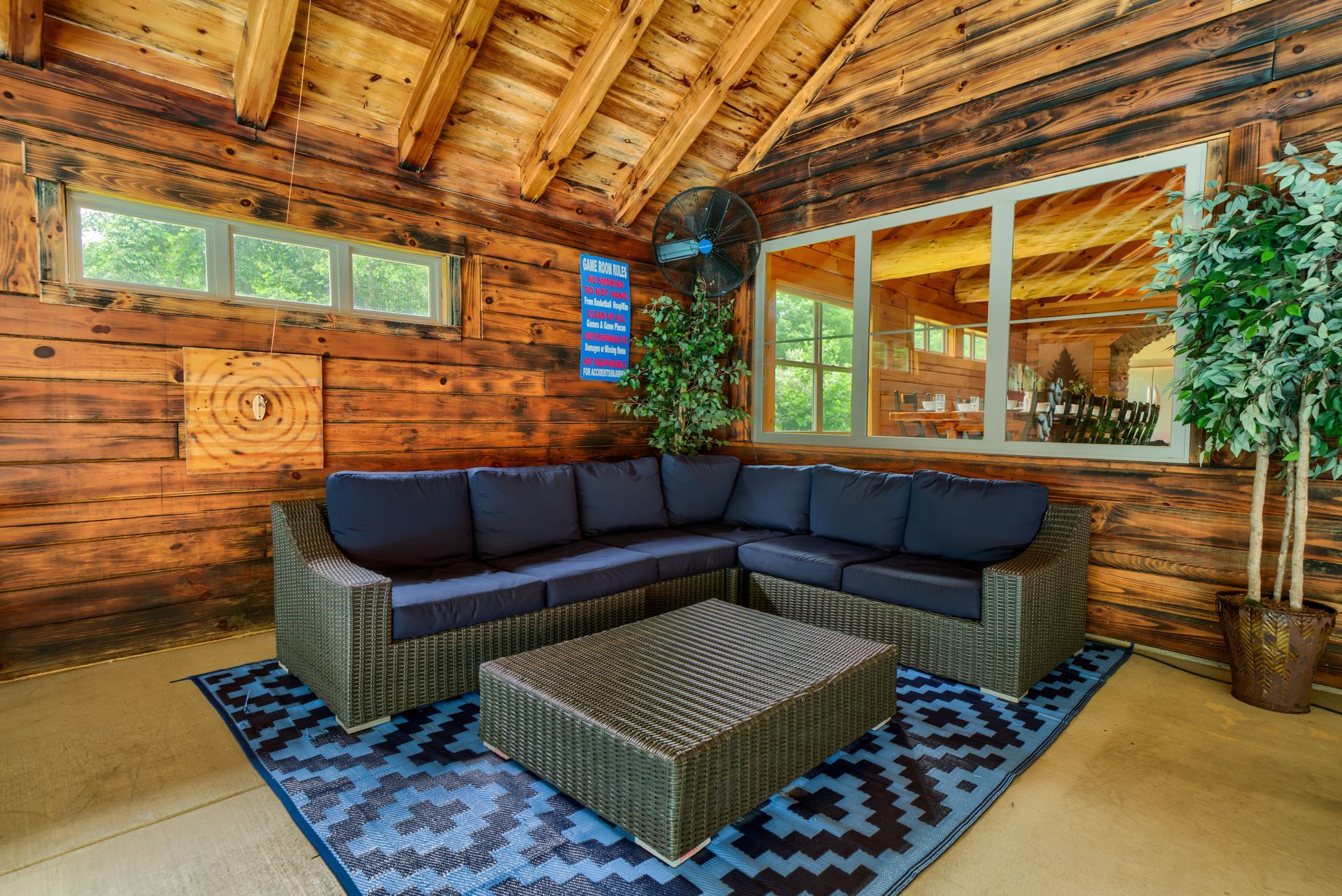 A living room with a sectional couch and a coffee table.