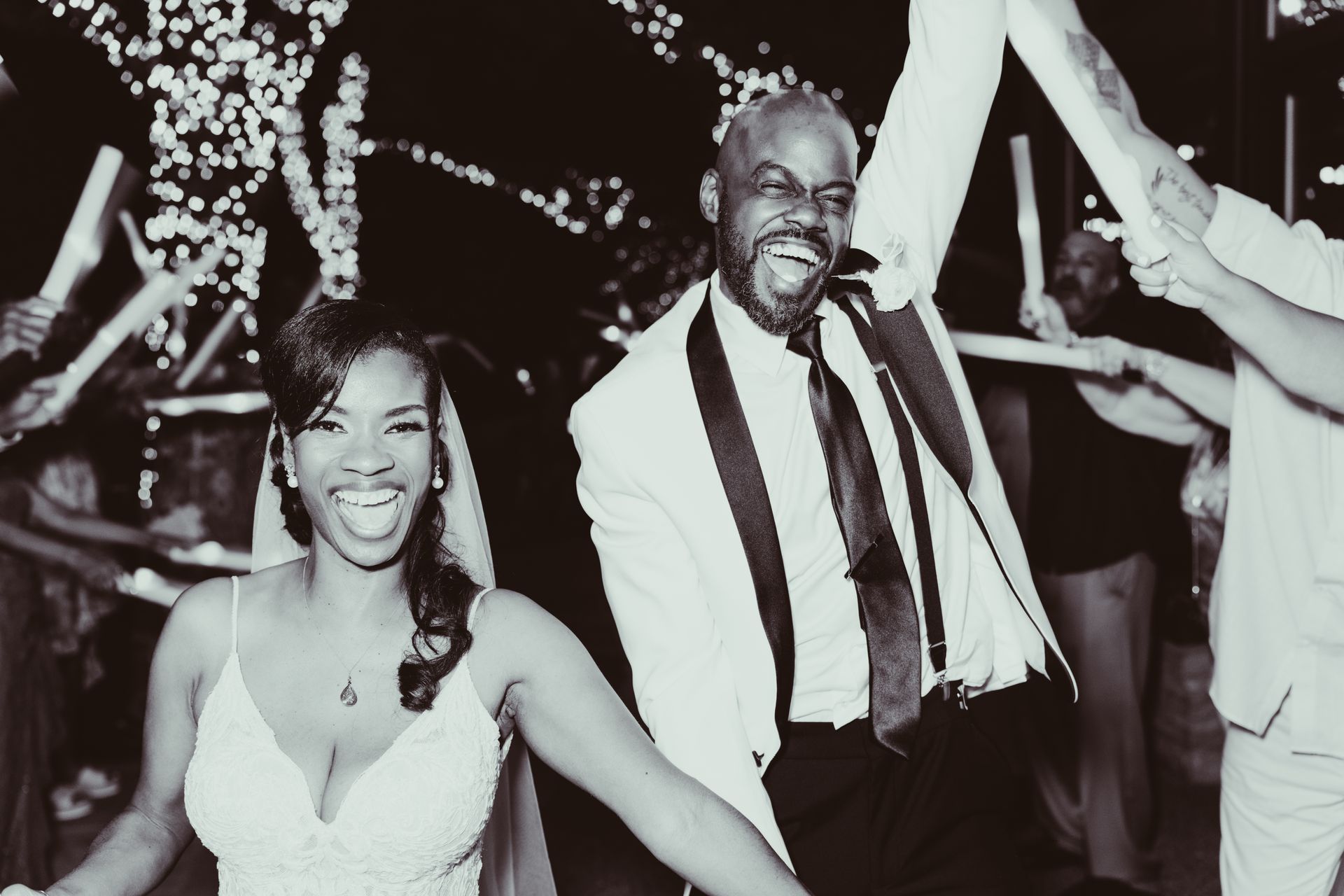 A black and white photo of a bride and groom sparkler exit at darby house.