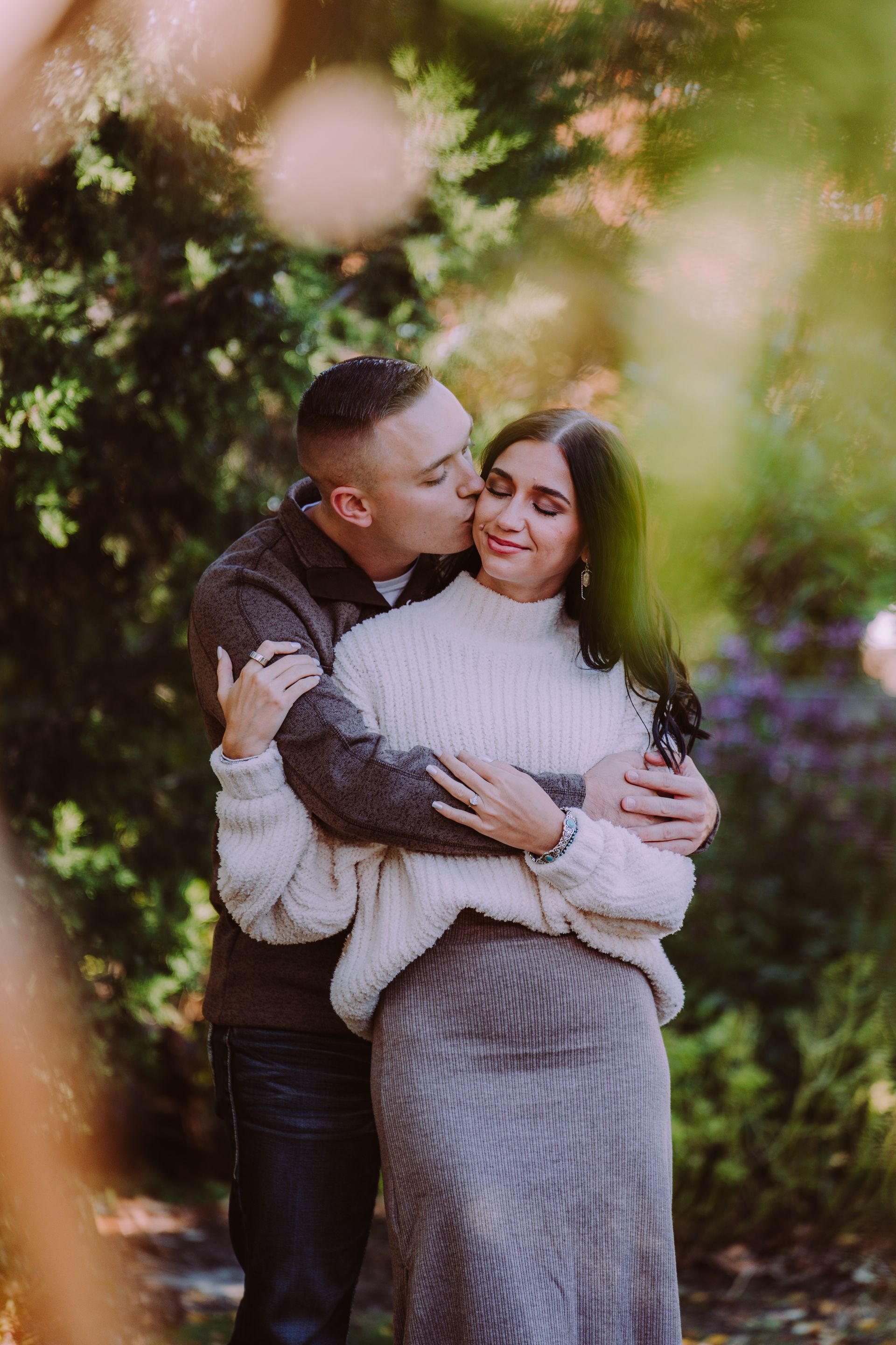 A man and a woman are walking down a brick sidewalk holding hands in downtown columbus.