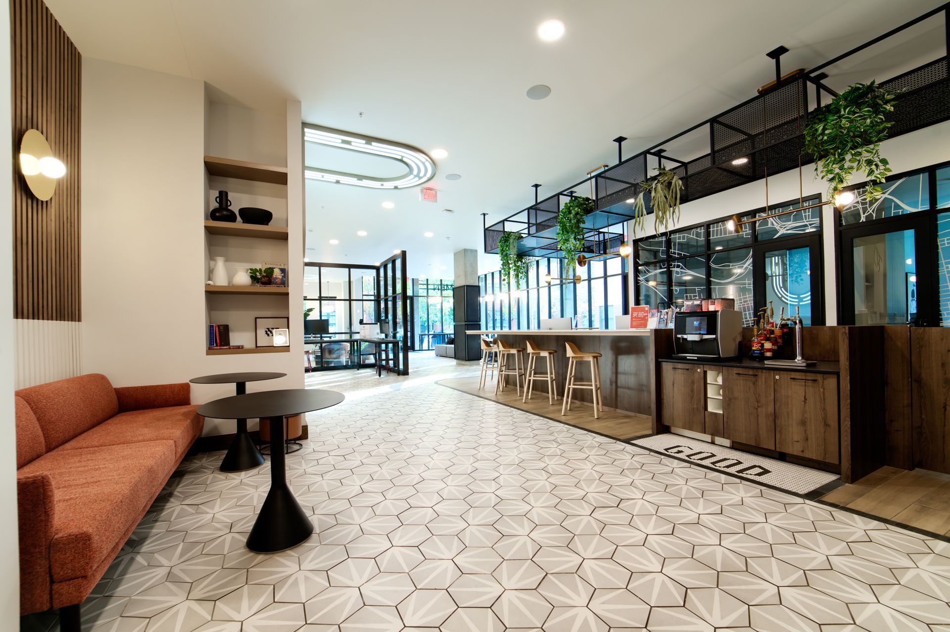A living room with a couch and a table in it.