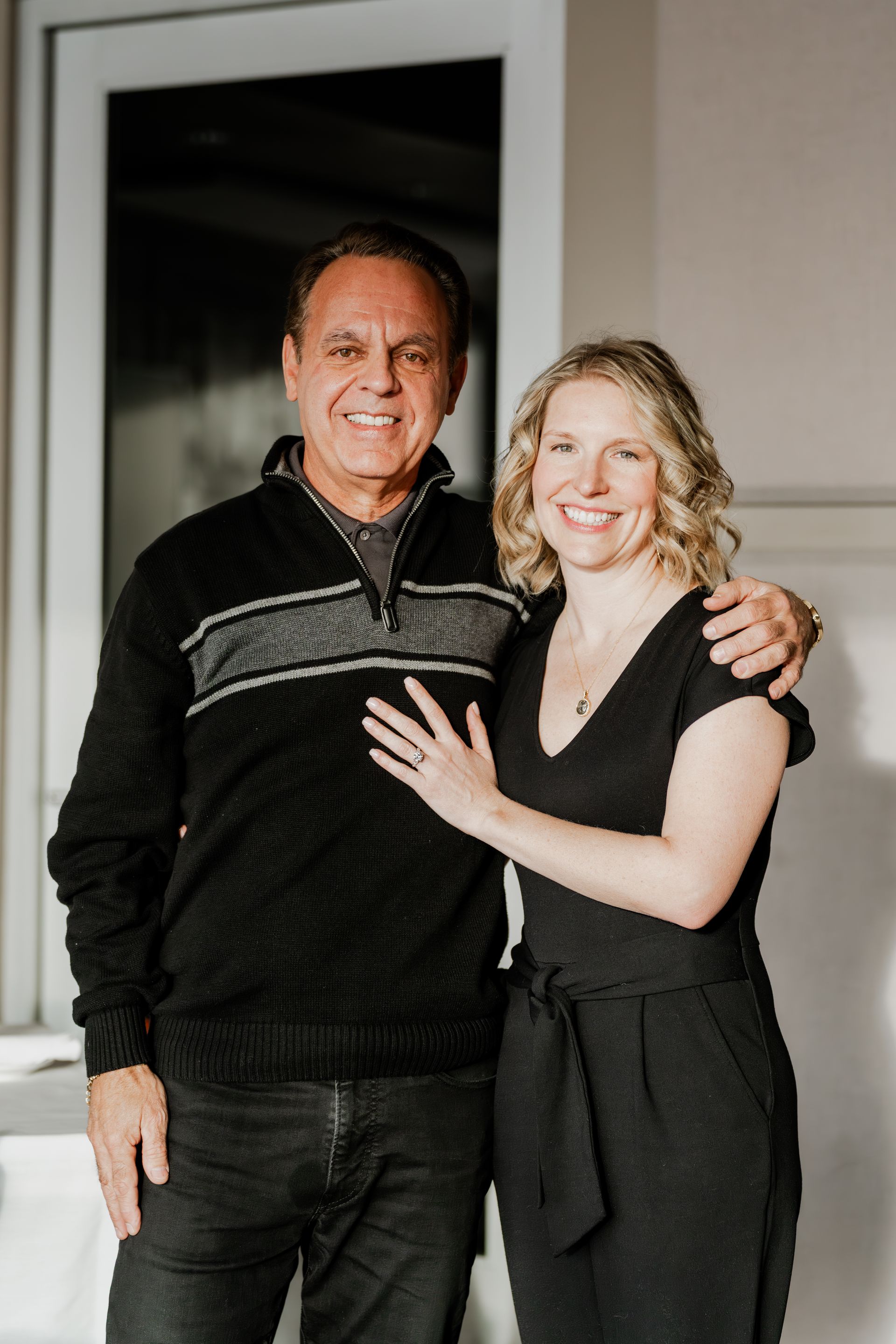A woman in a zebra print dress is standing in front of a window.