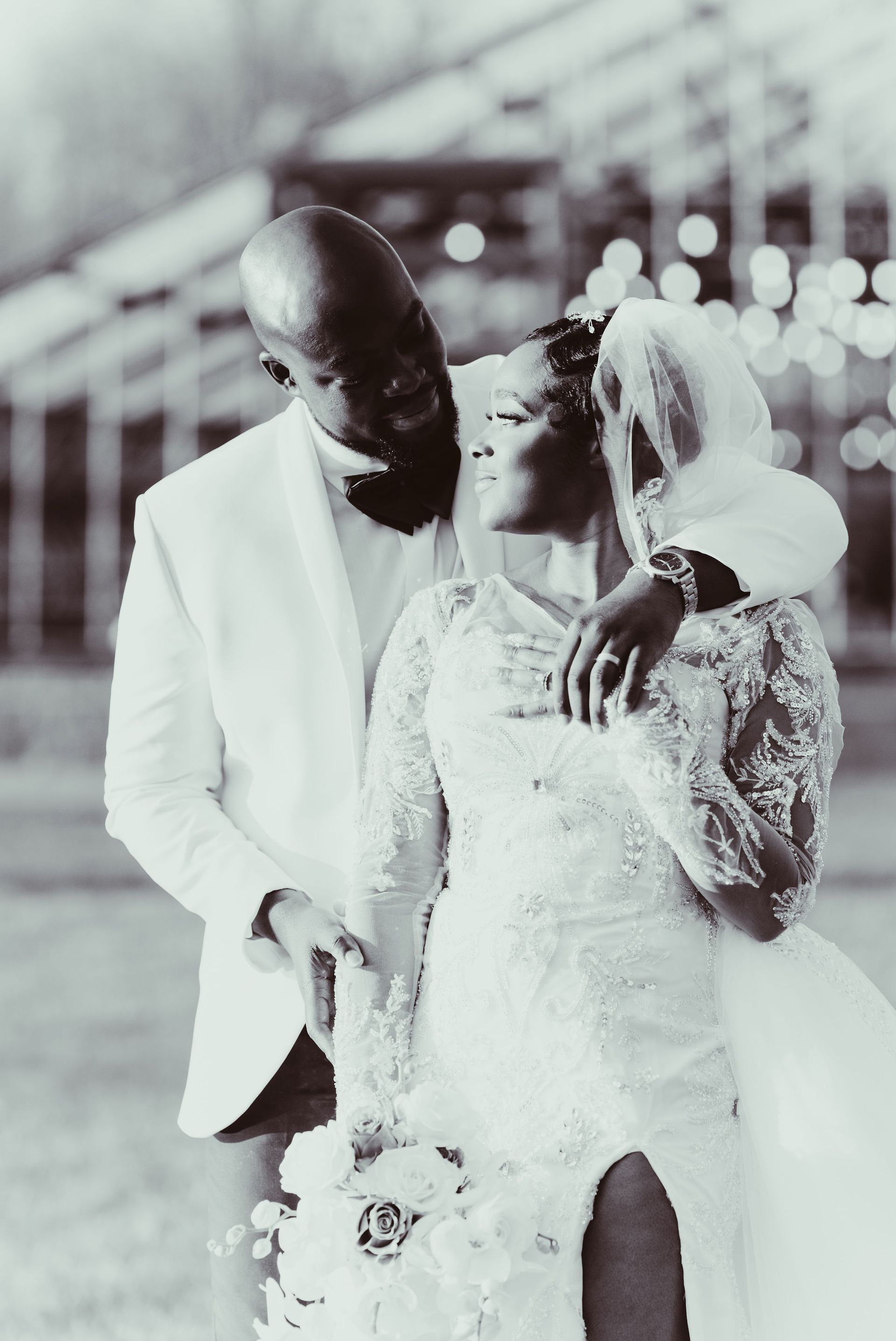 A black and white photo of a bride and groom