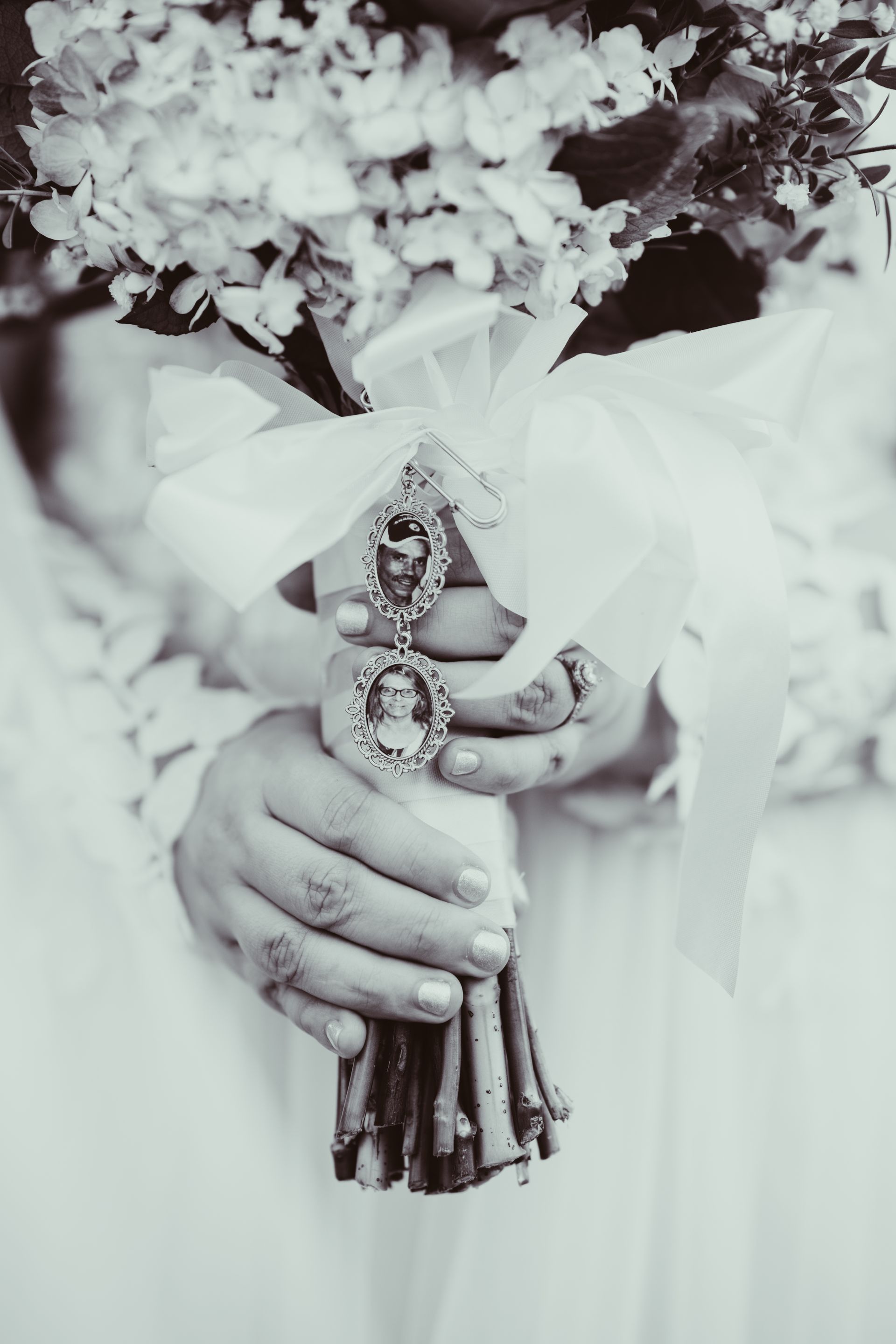 A woman is holding a bouquet of flowers in her hands.