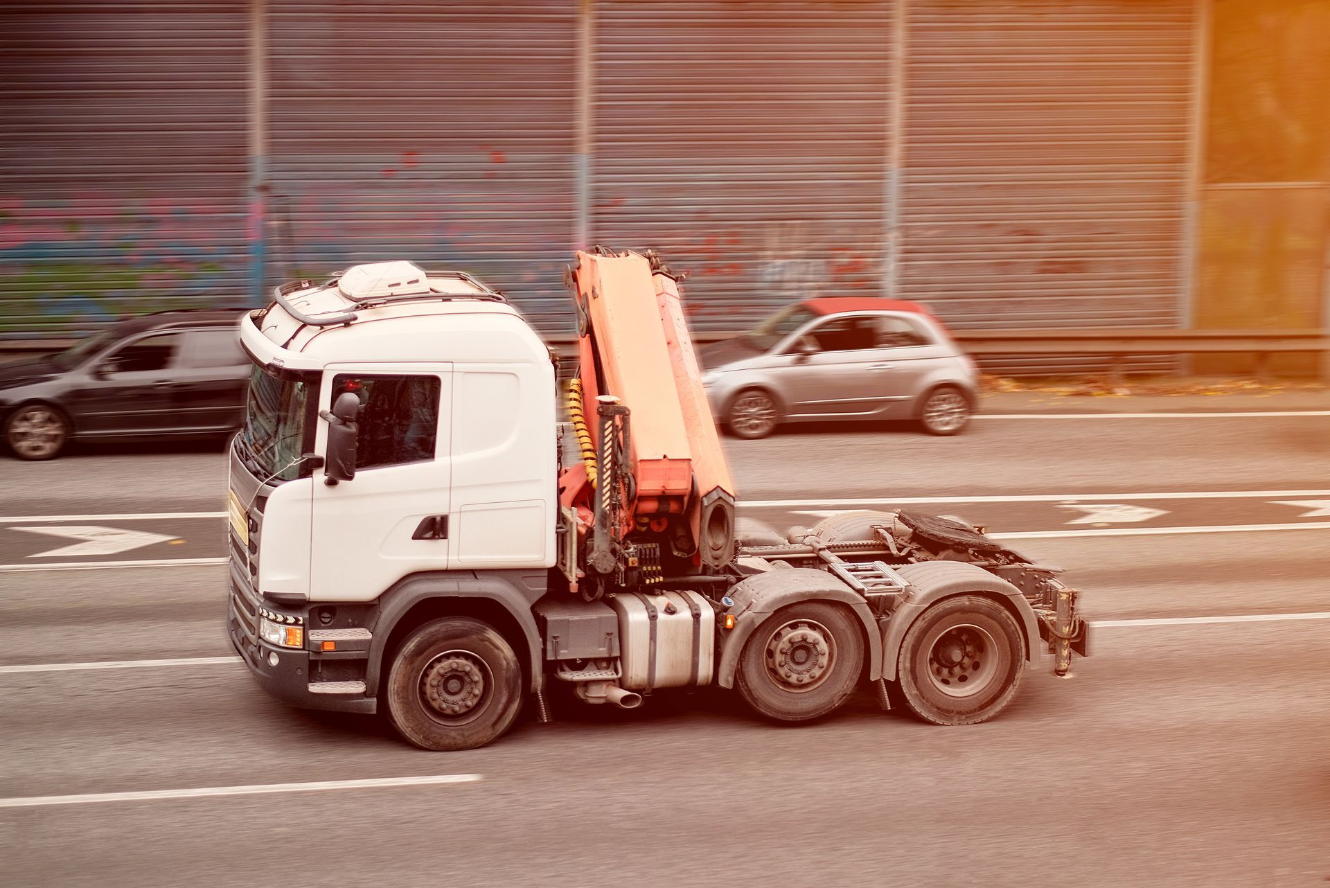 Interior of a room under construction with drywall on walls and ceiling, two doorways visible.