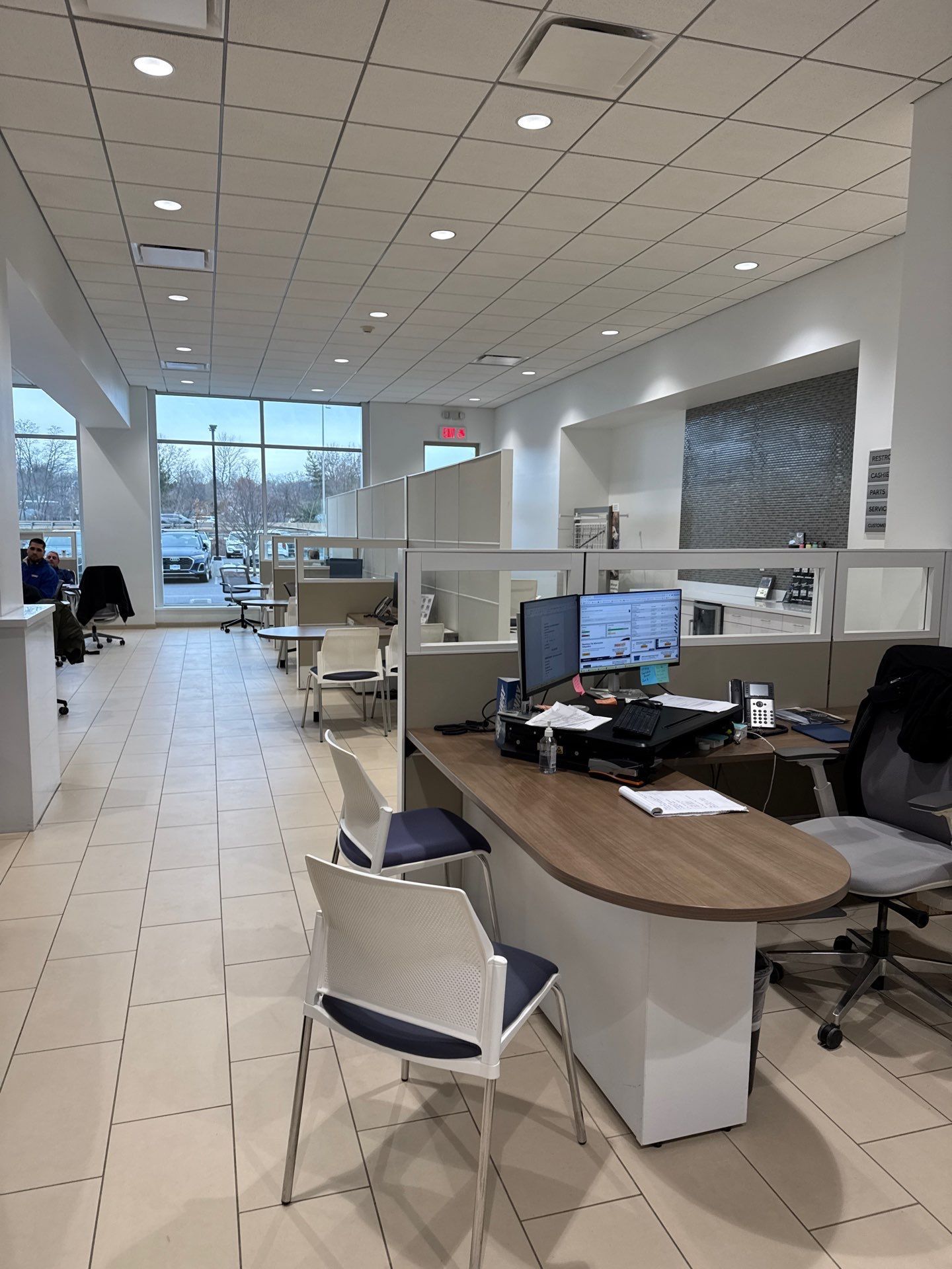 Office cleaning for adealership with open desk space.
