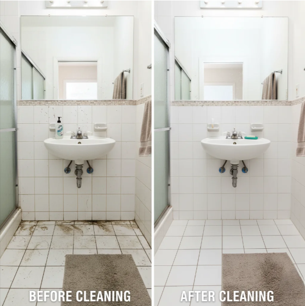 Person in blue gloves sanitizing a door handle with spray bottle and cloth in office setting.