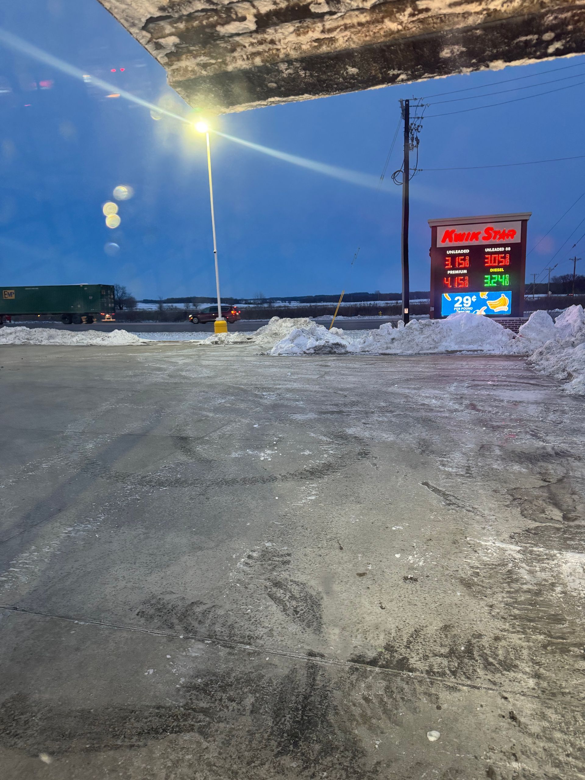A gas station with a sign that says ' robert shaw ' on it