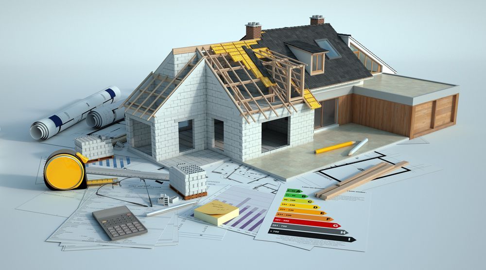 House under construction with blueprints, tools, and energy efficiency chart.