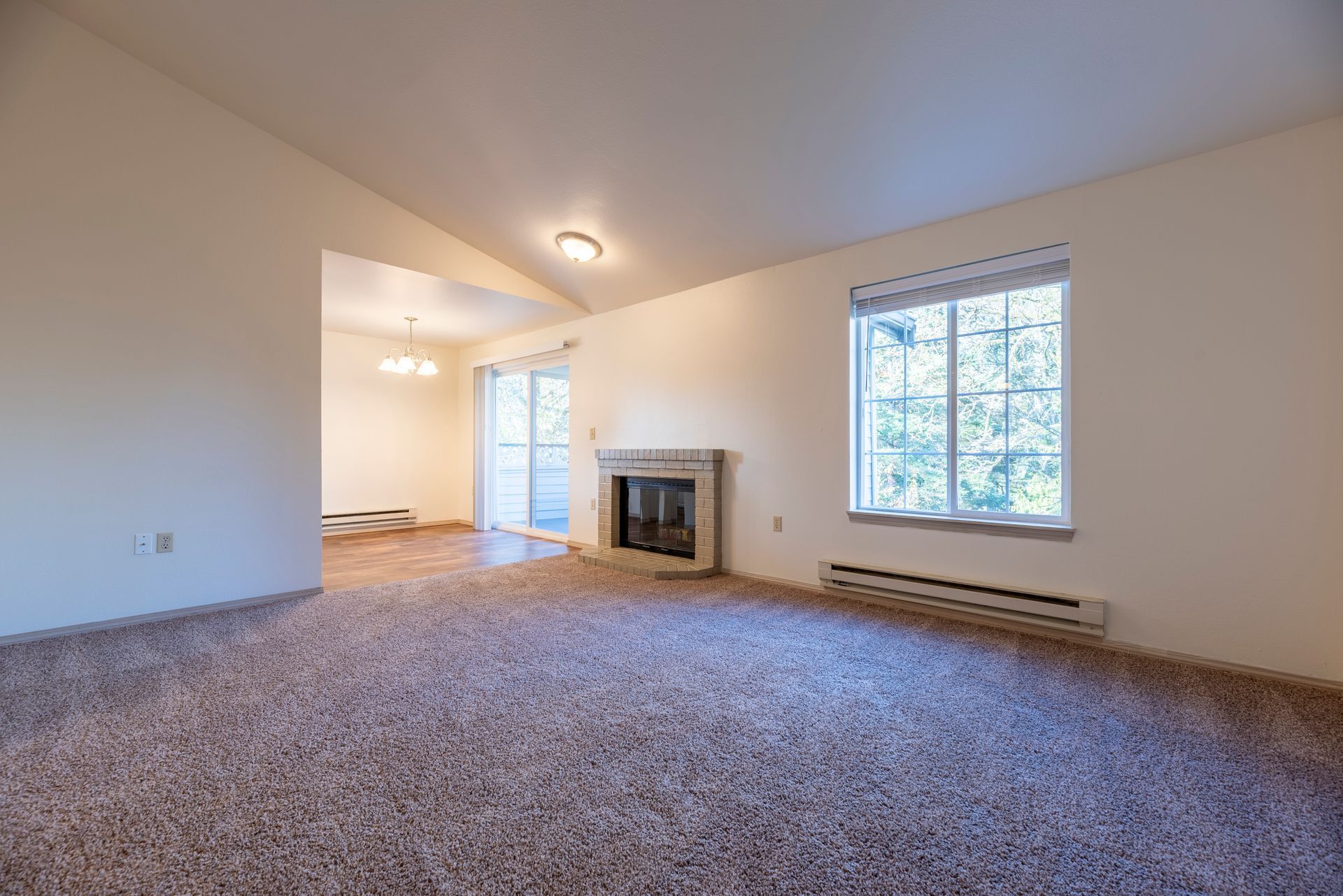 Living room, fireplace and vaulted ceilings
