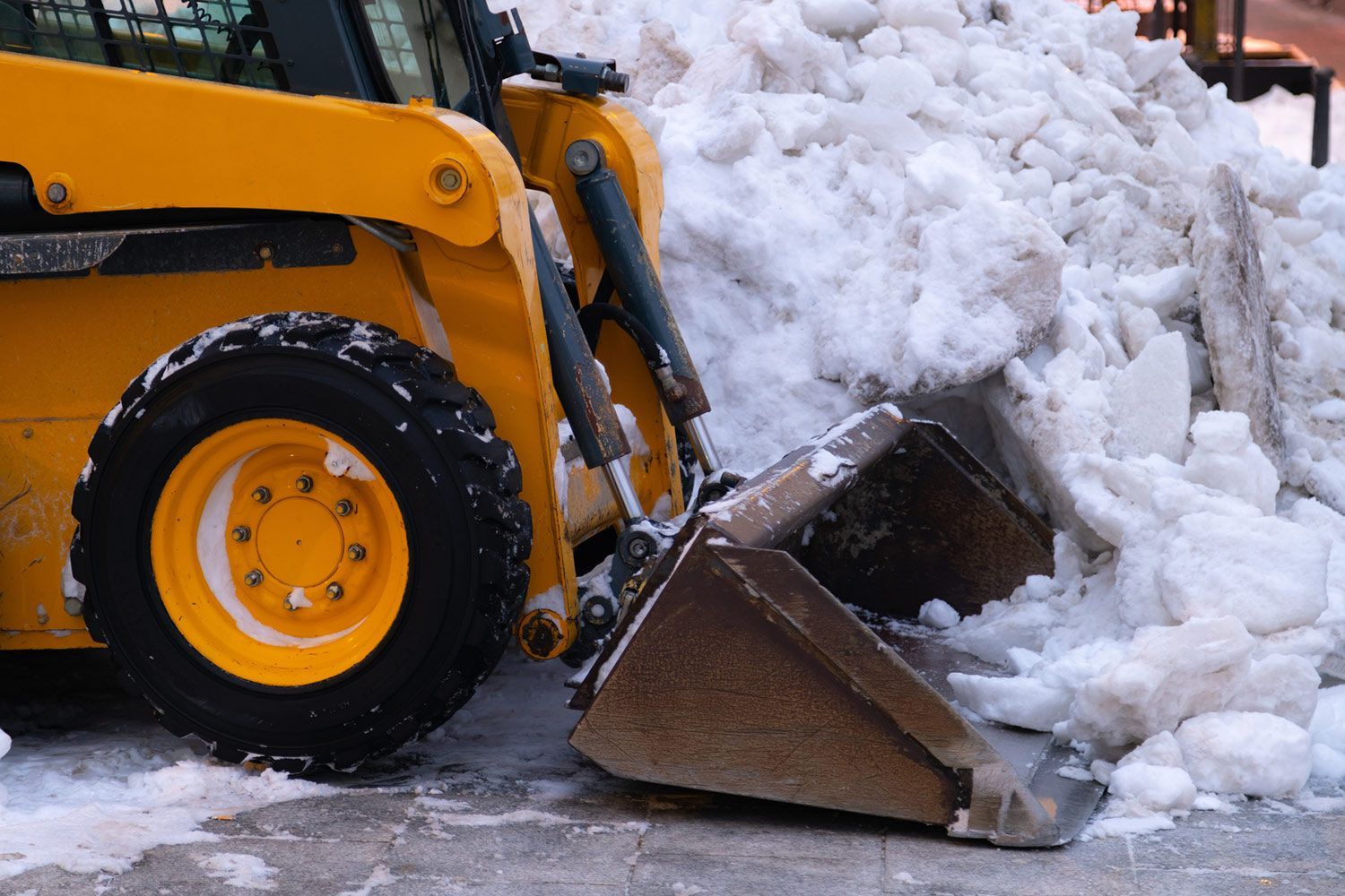 Yellow Snow Plow Truck Clearing the Road