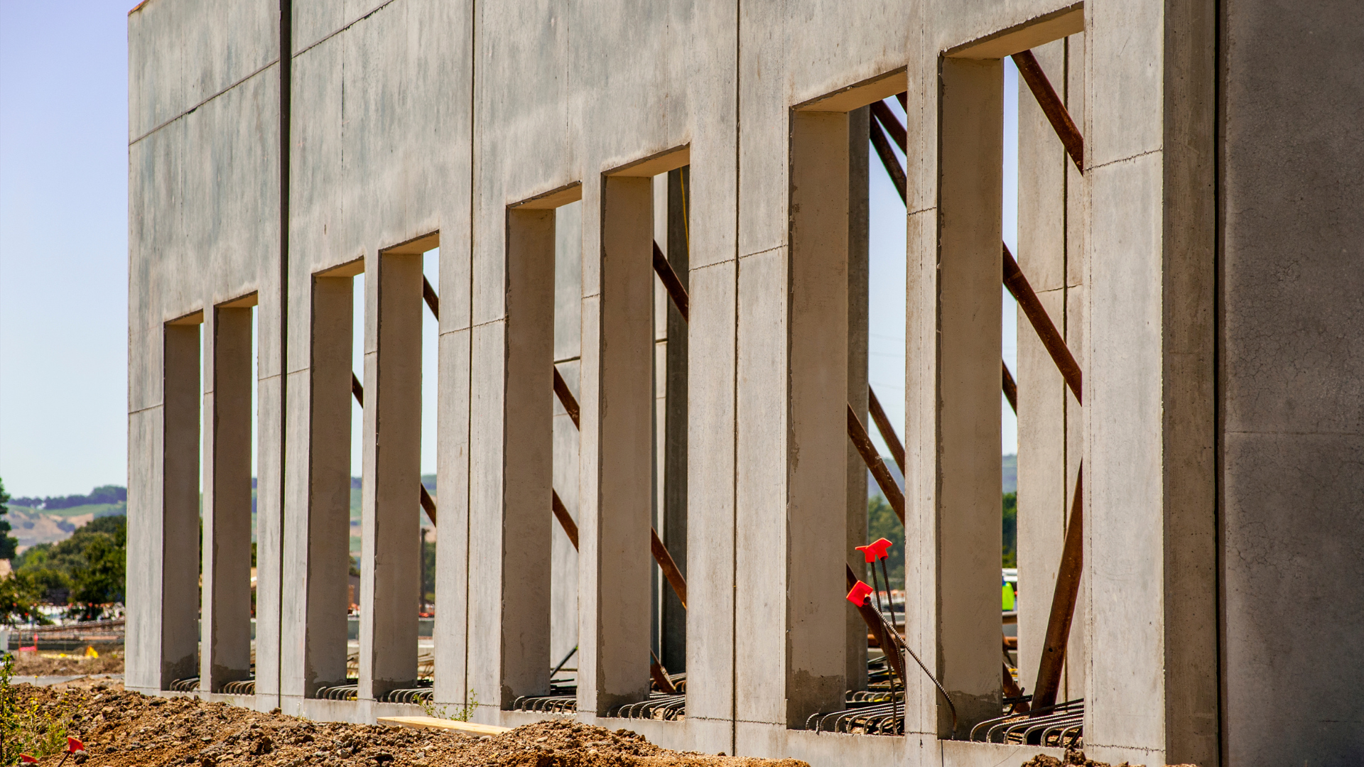 a commercial building wall being tilted up into position after curing