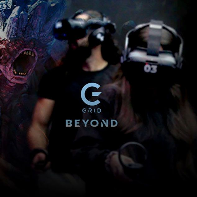 Players wearing VR headsets in the GRID BEYOND free-roam VR arena at The Grid Pleasant Grove Utah