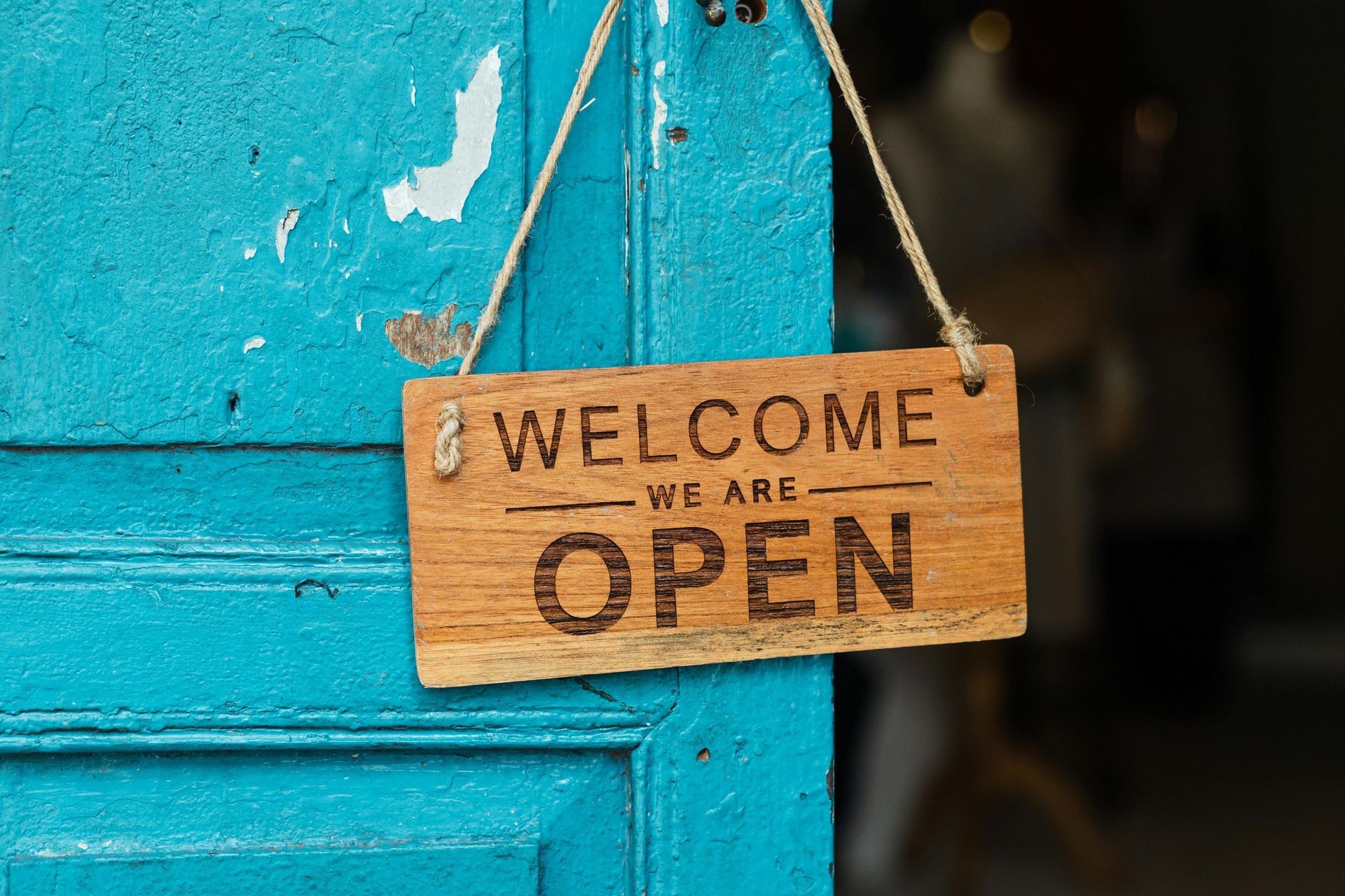 A sign on the exterior of a business that reads 