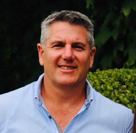 A Man Holding A Tool — Hayden Tree Service In Cooranbong, NSW