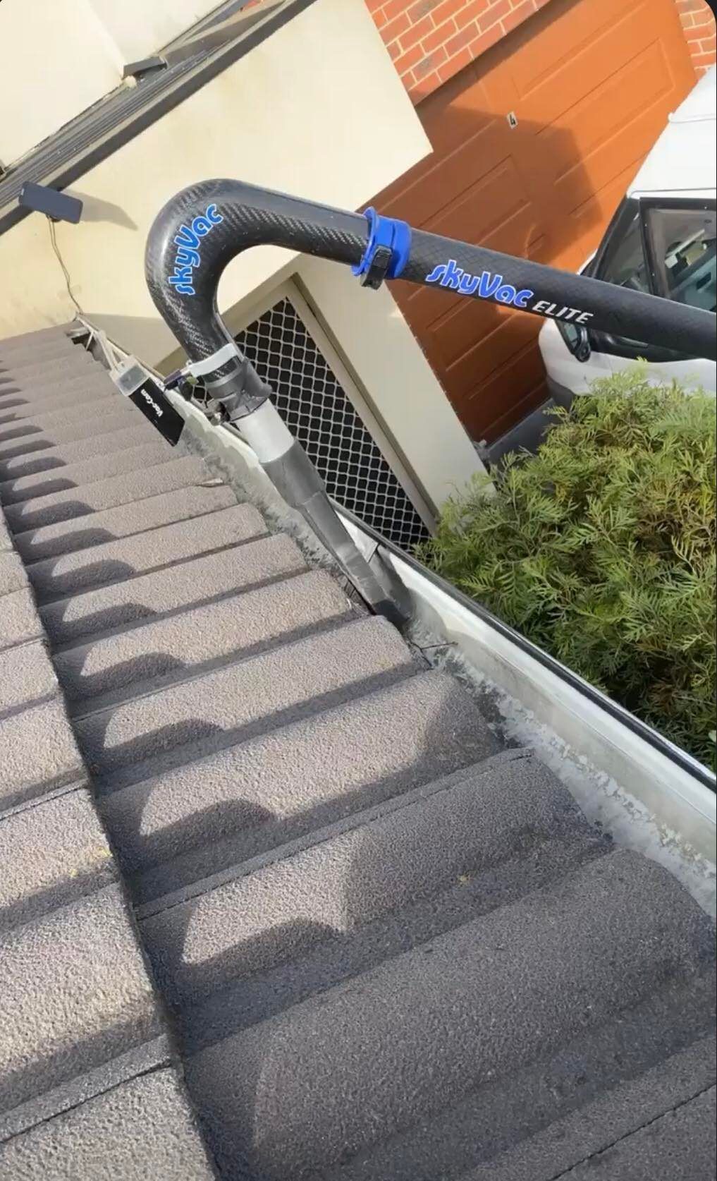 Gutter cleaning showing clear gutters after debris removal