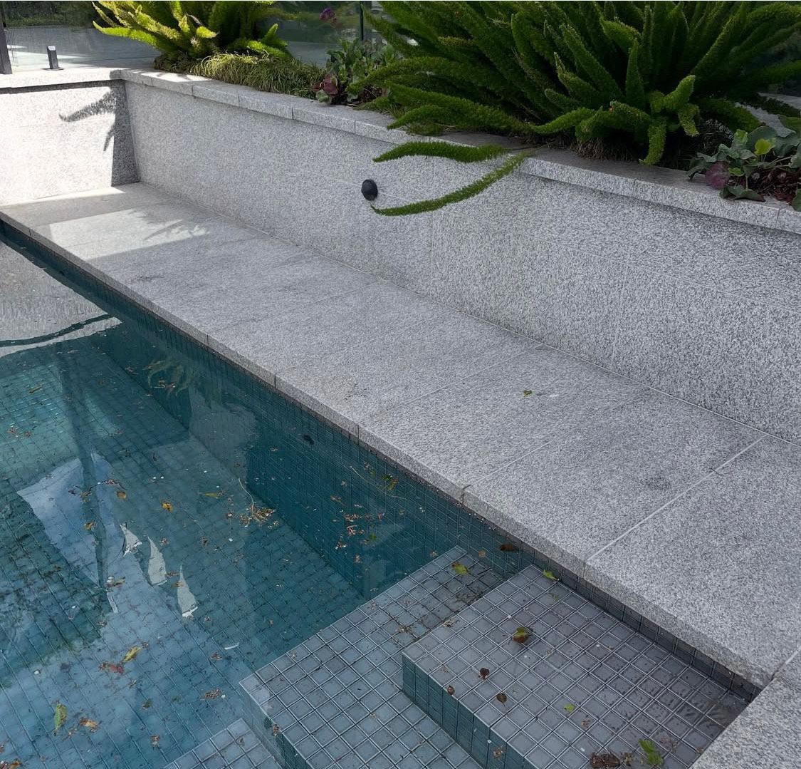 Pressure cleaned exposed dirty driveway in Melbourne, restored by Caddy Bins driveway pressure cleaning service