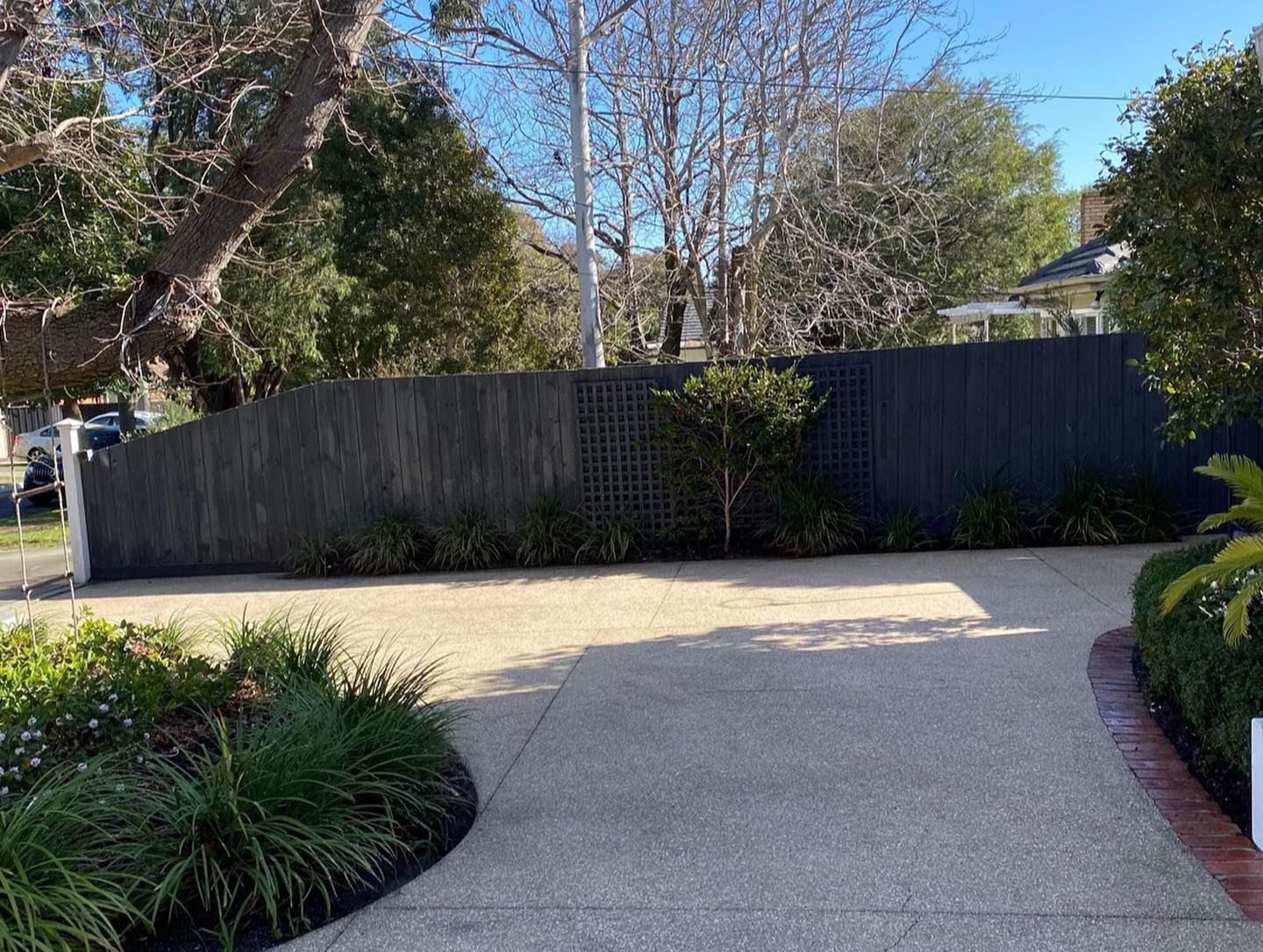 Exposed aggregate driveway cleaning and garden edging maintenance in Melbourne by Caddy Bins