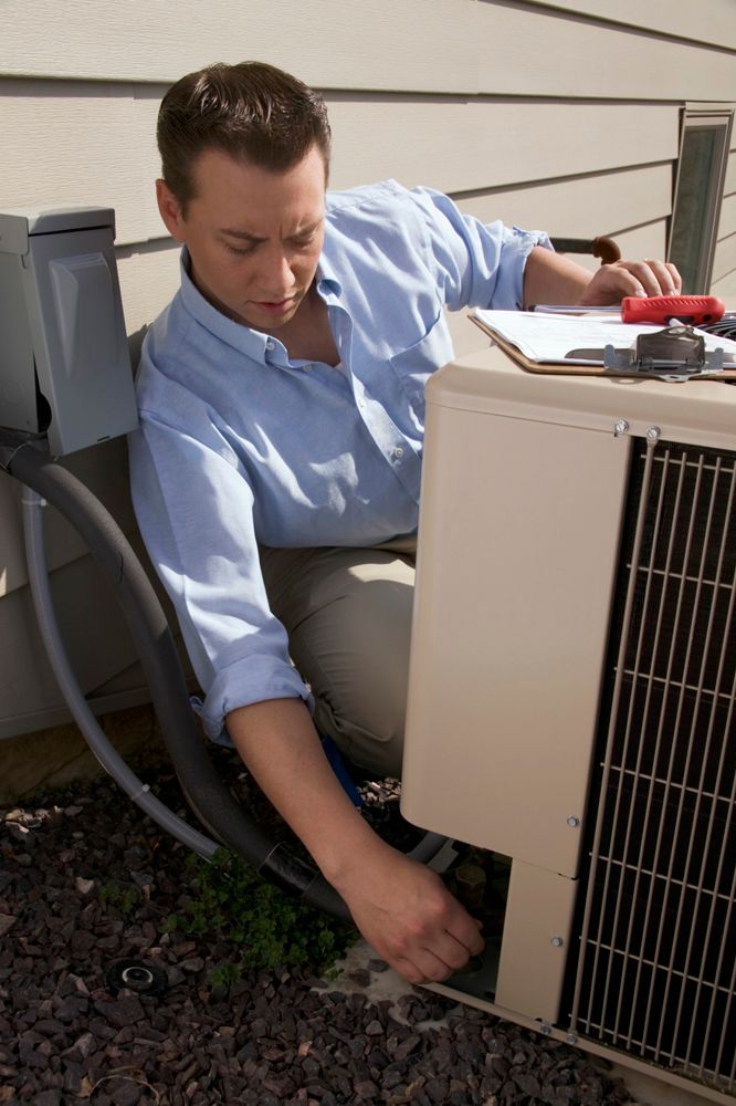 inspecting outdoor HVAC unit