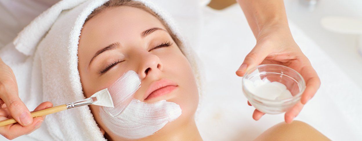 Face Spa —  Woman Applying Facial Cream in Concord, NC