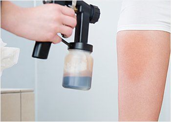 Beauty Services — Woman Getting Spray Tan in Concord, NC