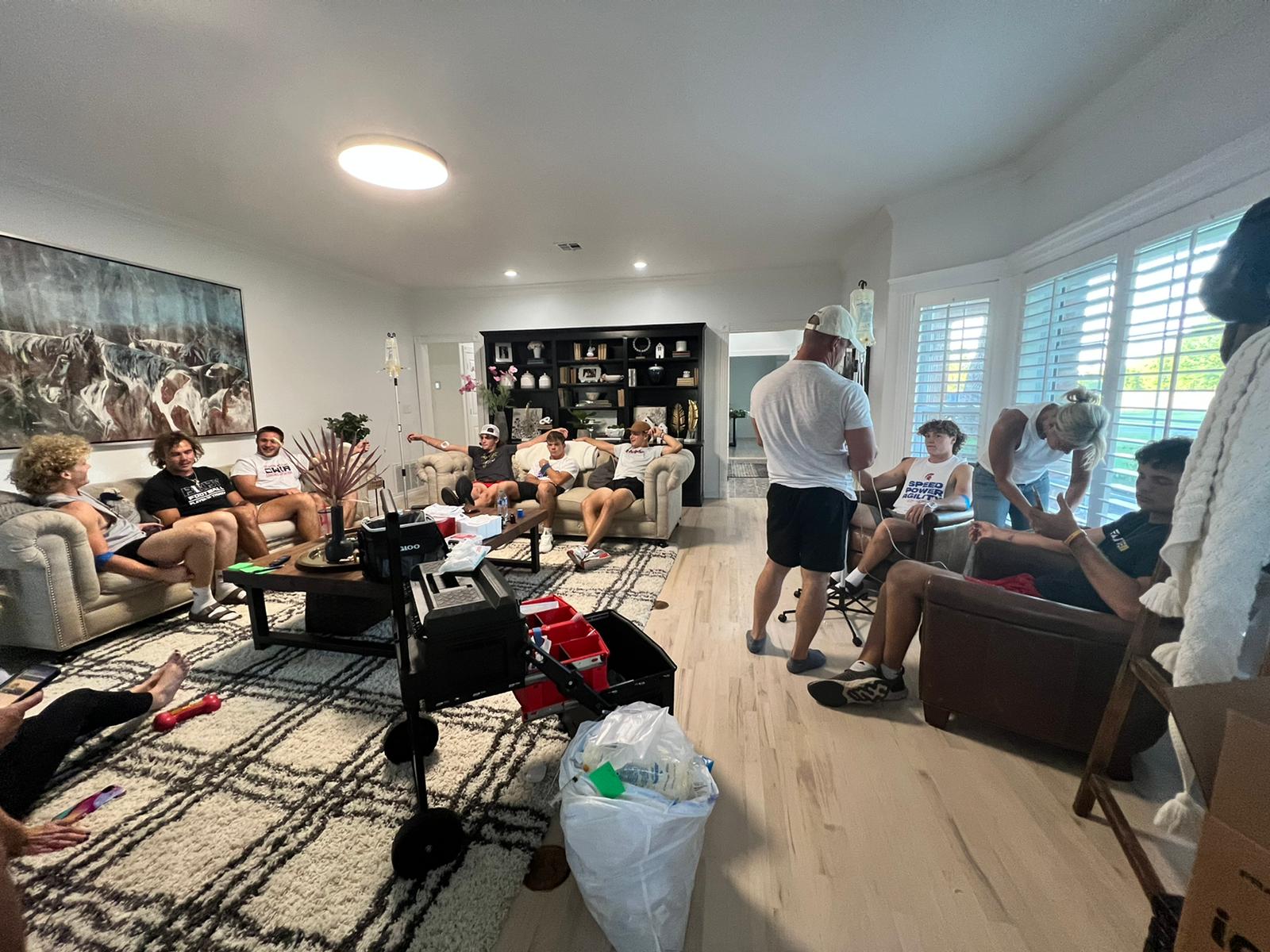 A group of people are sitting in a living room.