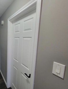 picture of white interior door with white trim around the door in Kitchener