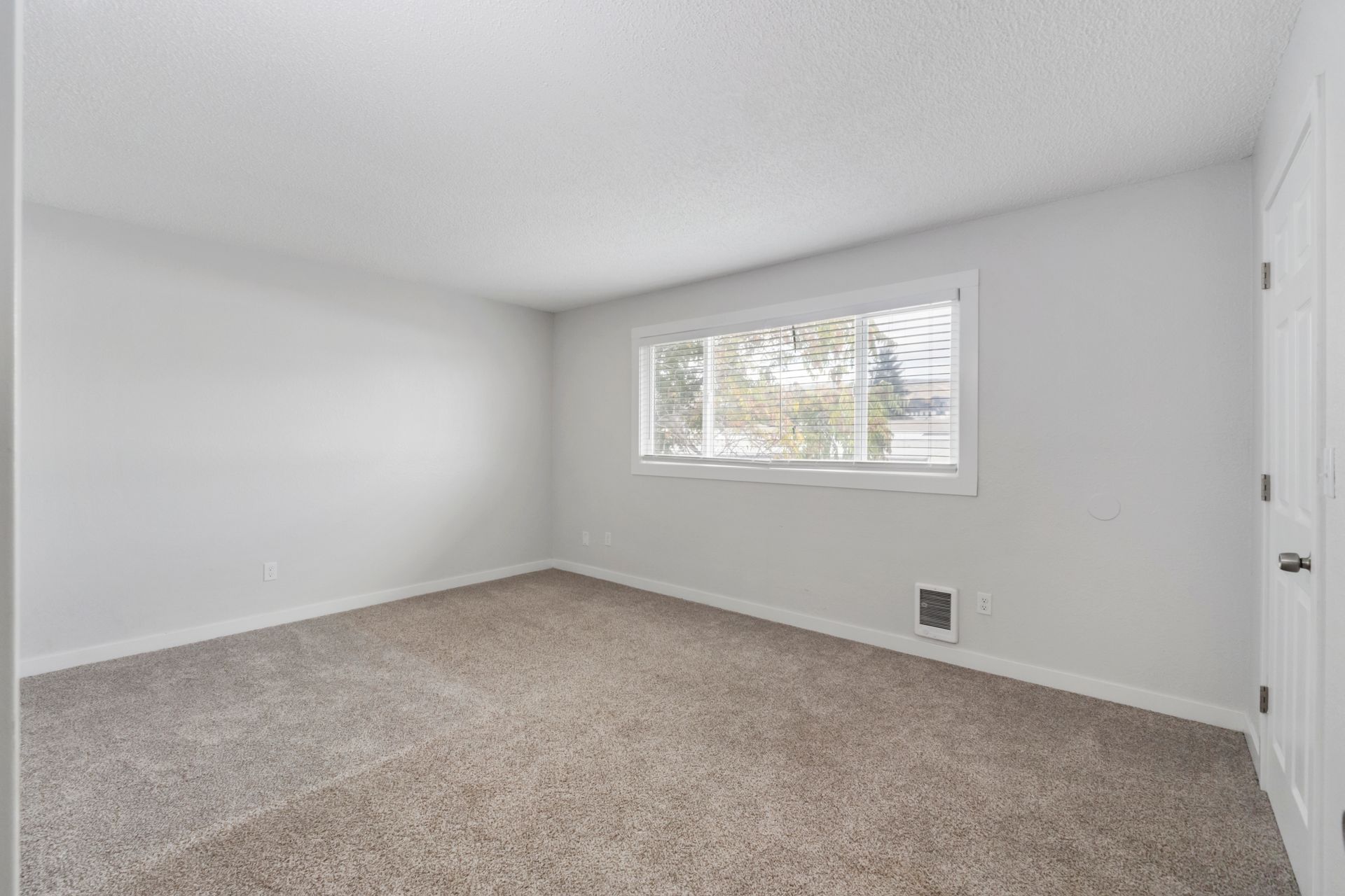 There is a large window in the middle of the room.