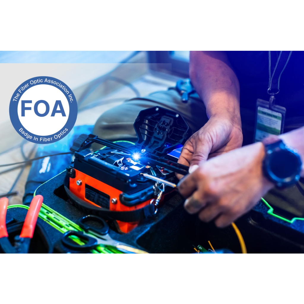 Technician working with fiber optic equipment, FOA logo in the corner.