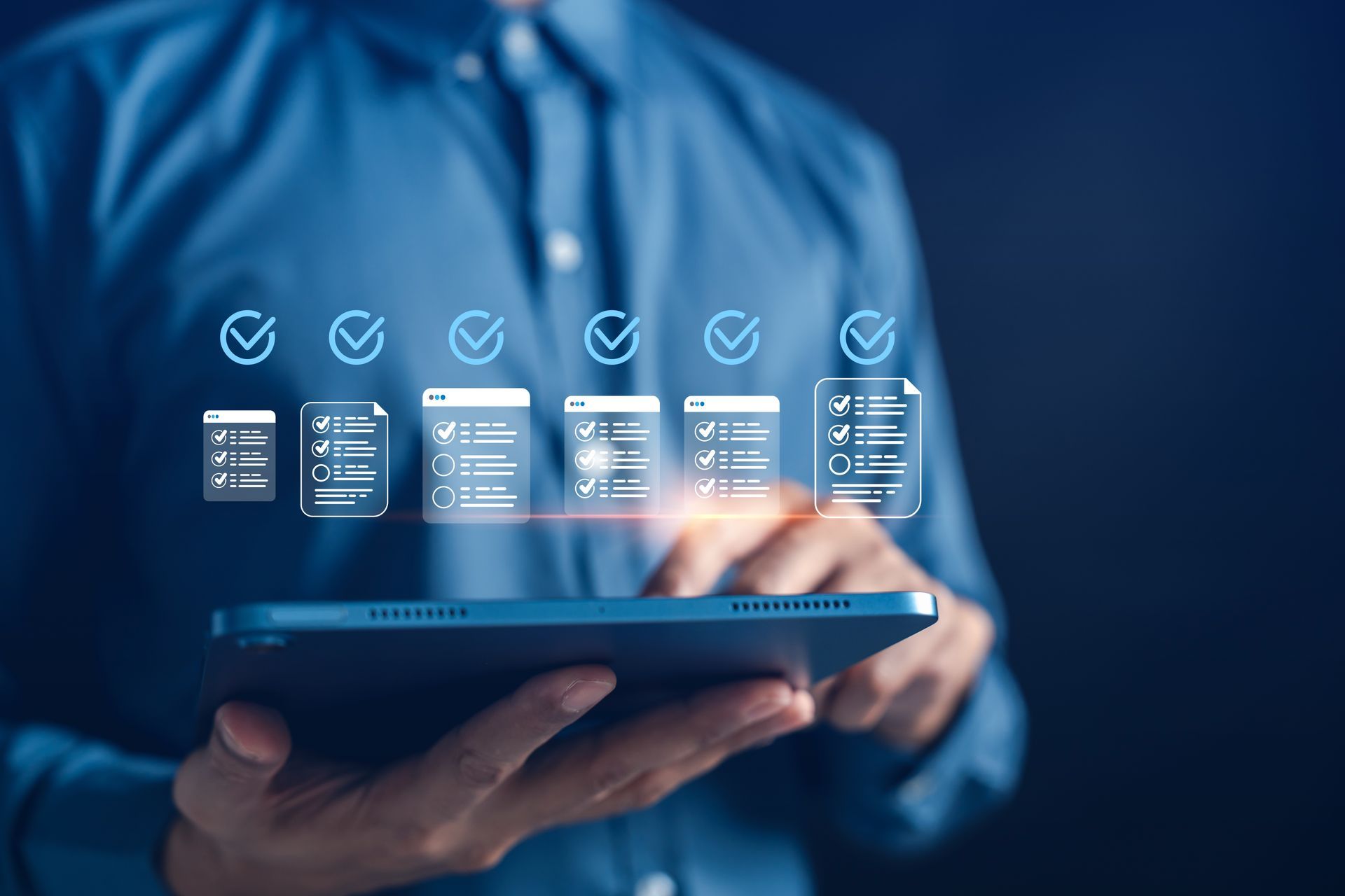 Person holding tablet, interacting with digital checklist icons.