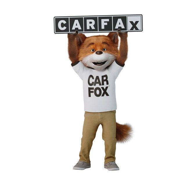 Car Fox mascot holding a