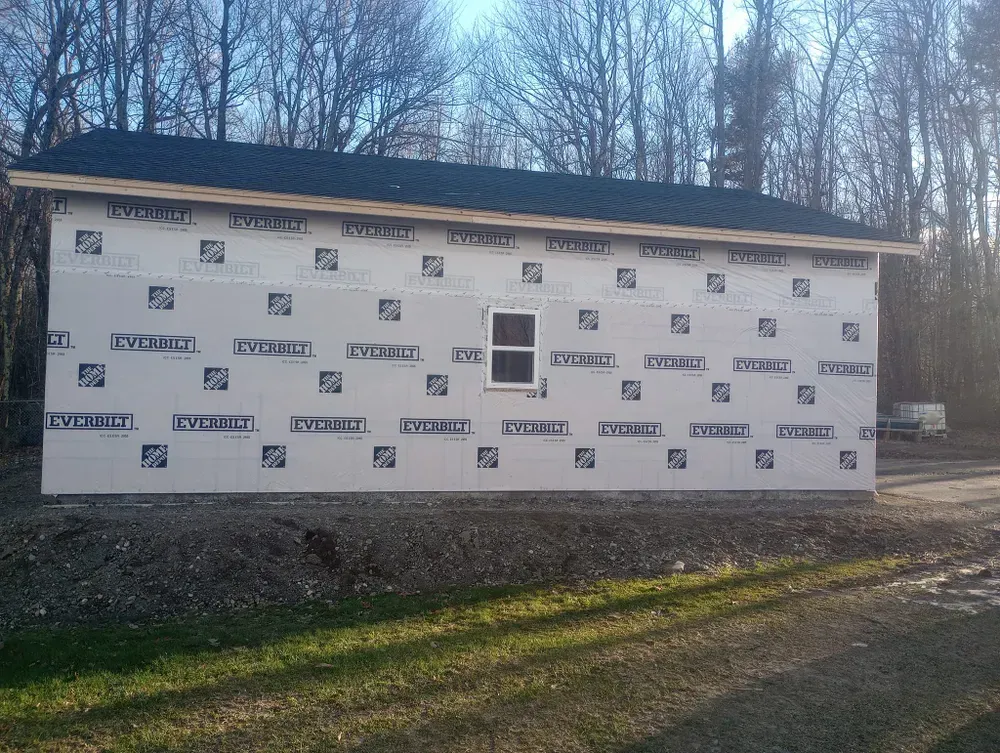 A building with a window and a roof is being built