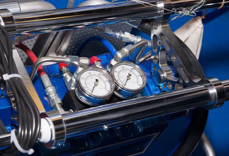 A Close Up Of A Car Engine With Two Gauges On It — Eureka Water & Filtration In Mount St John, QLD