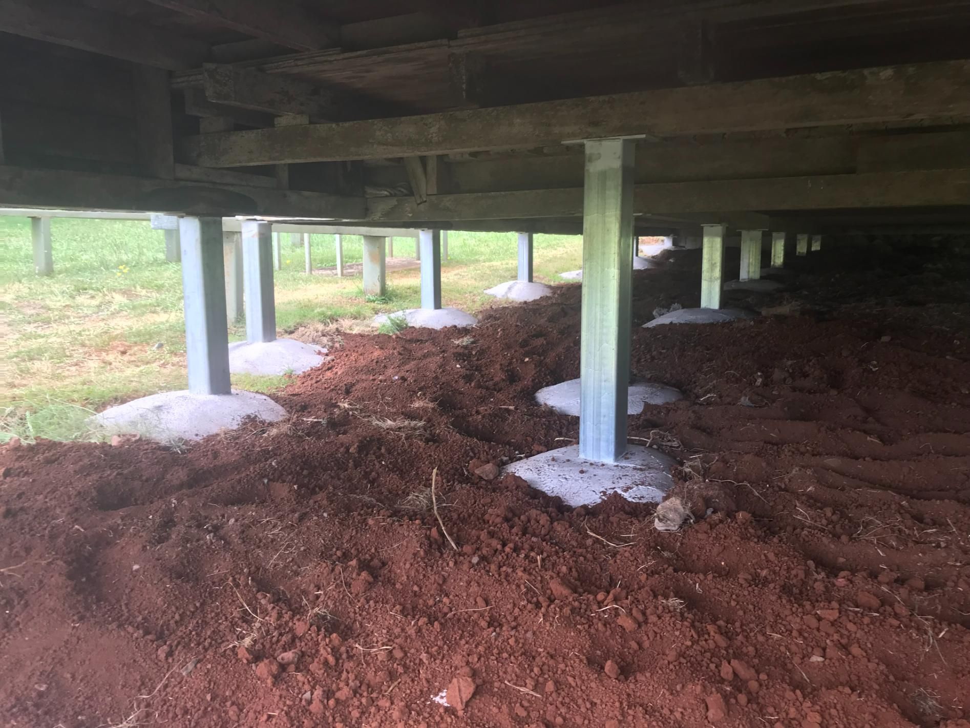The Underside of a House With a Lot of Dirt Underneath It — Wilson's House Restumping in Coraki, NSW