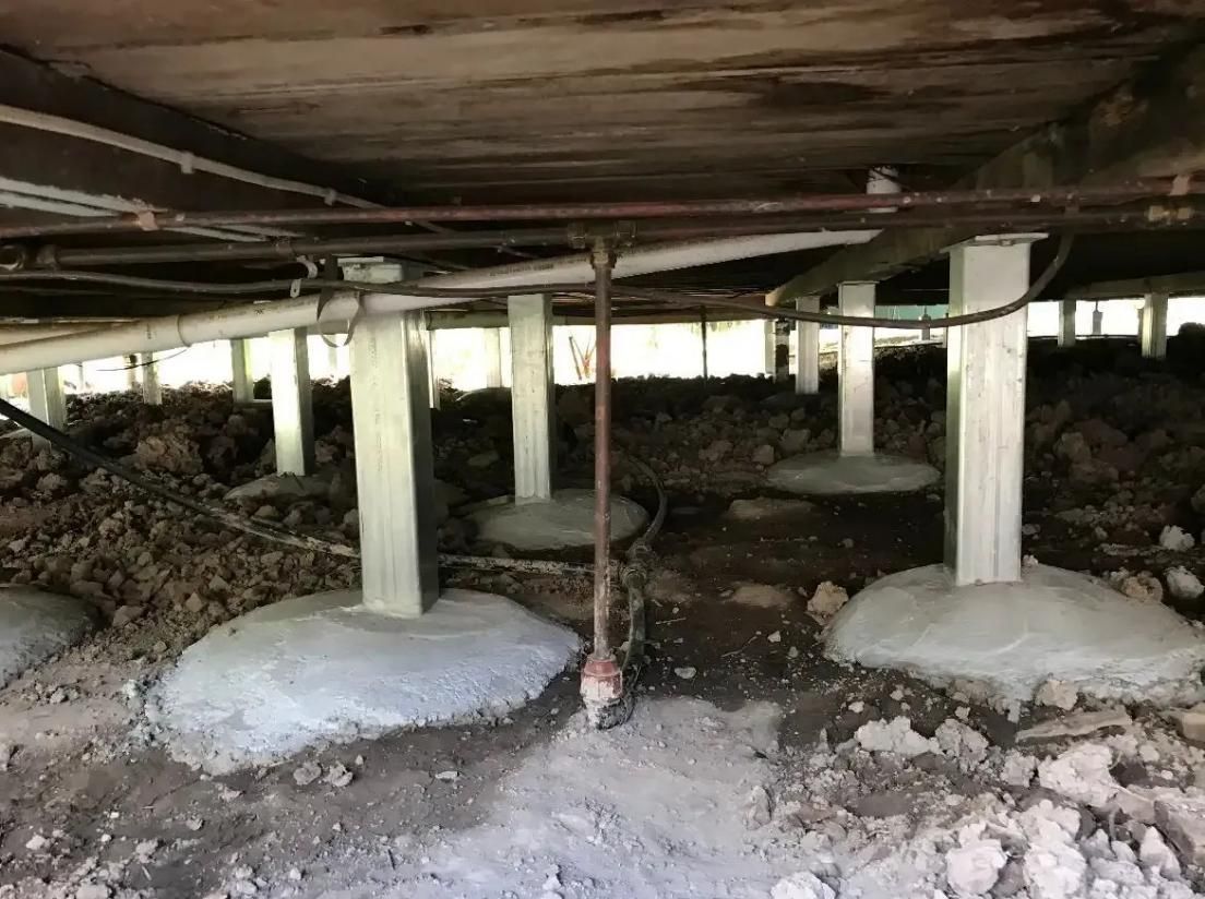 The Foundation of a House With Concrete Pillars and Pipes — Wilson's House Restumping in Goonellabah, NSW