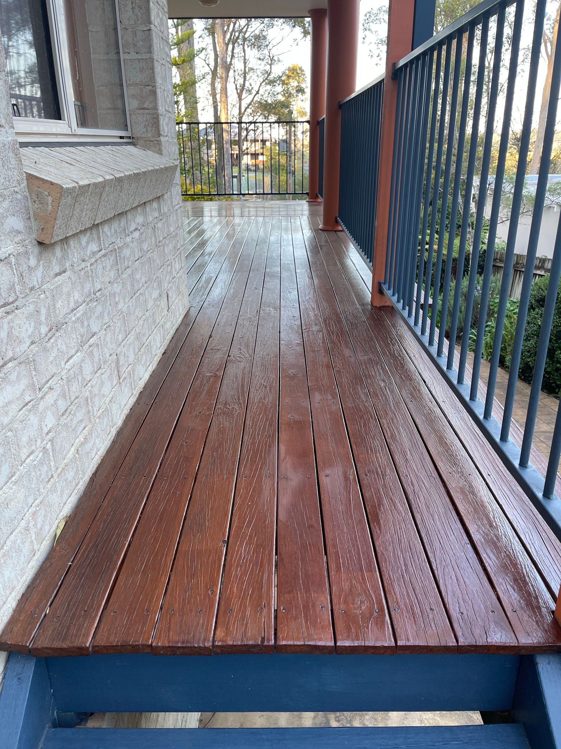 Freshly Cleaned Wooden Deck Shining in the Sunlight — Nowra Painting Services In Bomaderry, NSW