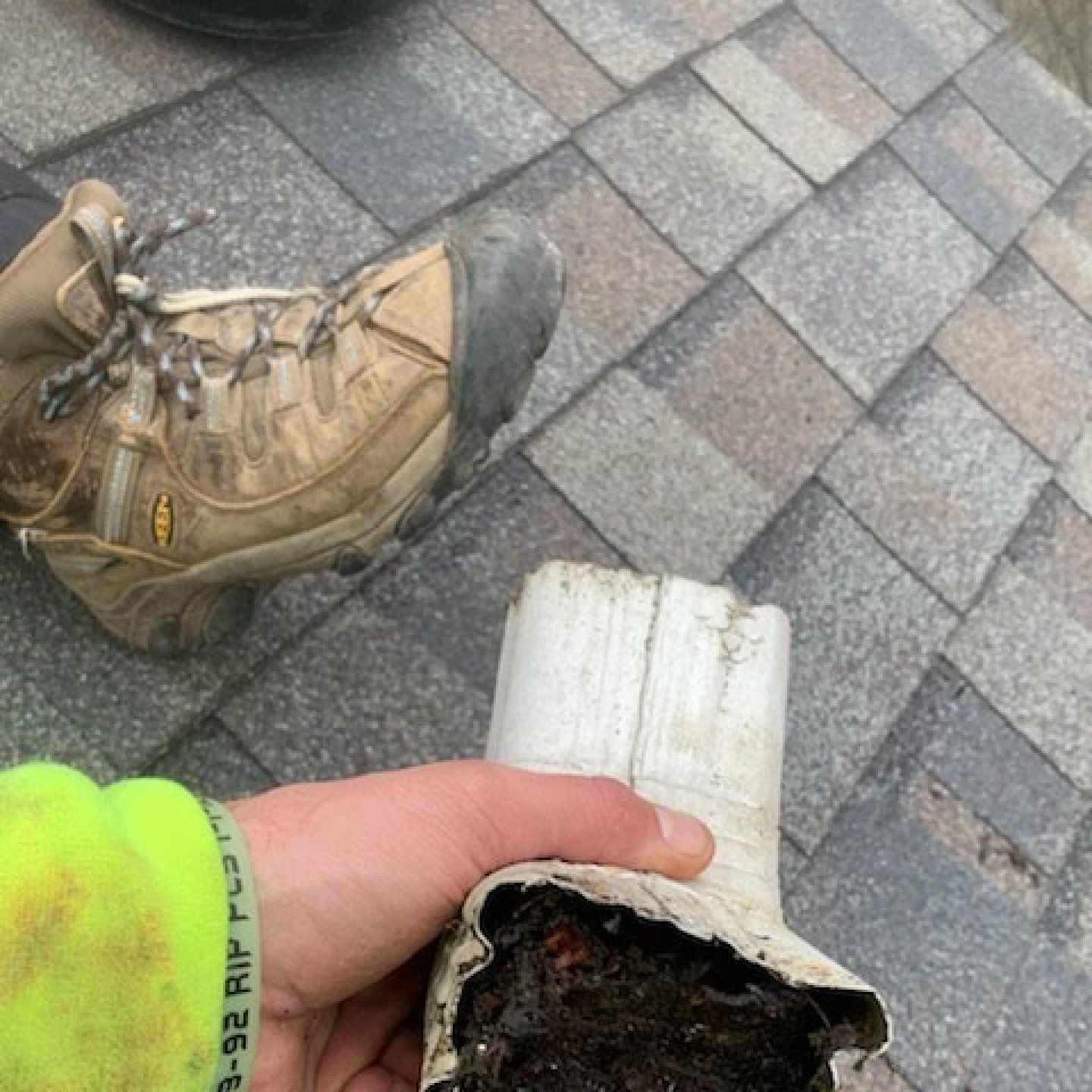 gutter stick, clogged gutters, clogged downspouts